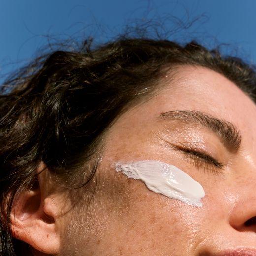 Woman with Sunscreen on Cheek