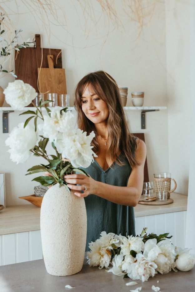 Arrangement of white peonies in a vase.