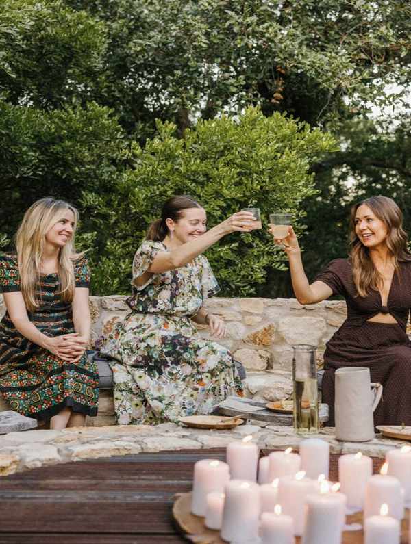 ladies doing cheers outside around fire pit_ovulatory phase