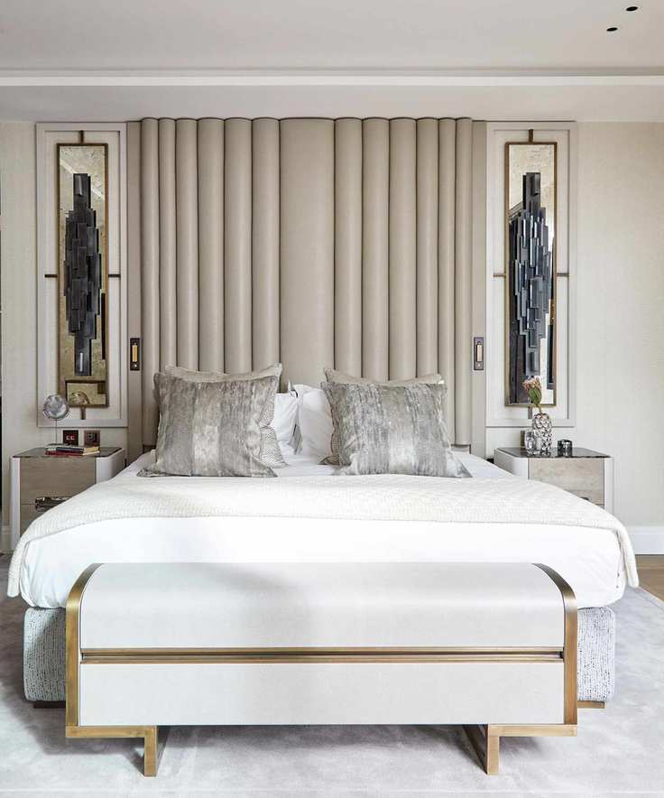Box room ideas shown in a pale color scheme with double bed and headboard lighting