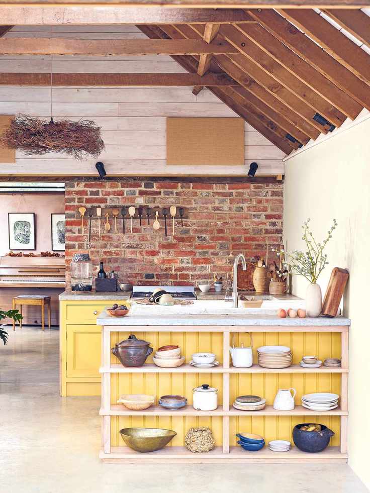 Kitchen with an island in Sunflower chalky matt from Sanderson Design Group