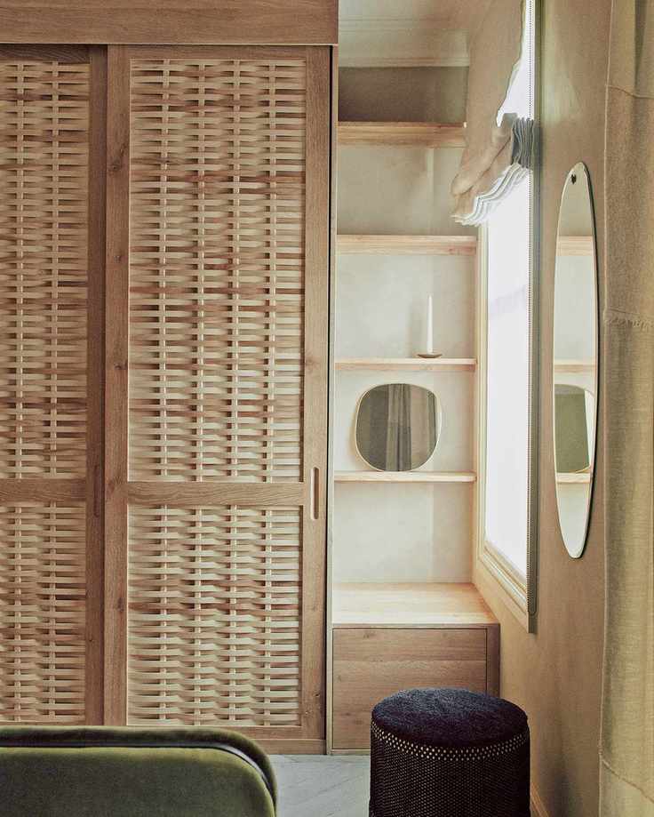 Beige bedroom with light wood wardrobe by Sebastian Cox