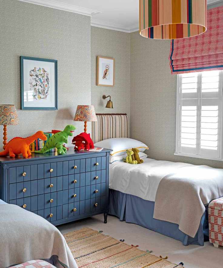 kids room with two beds and cuddly toys