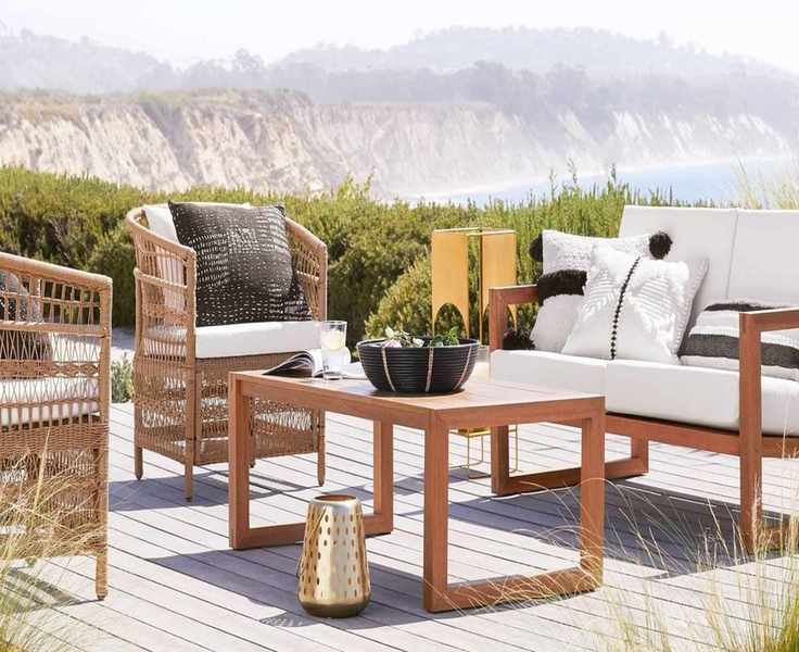 A wooden loveseat and chairs