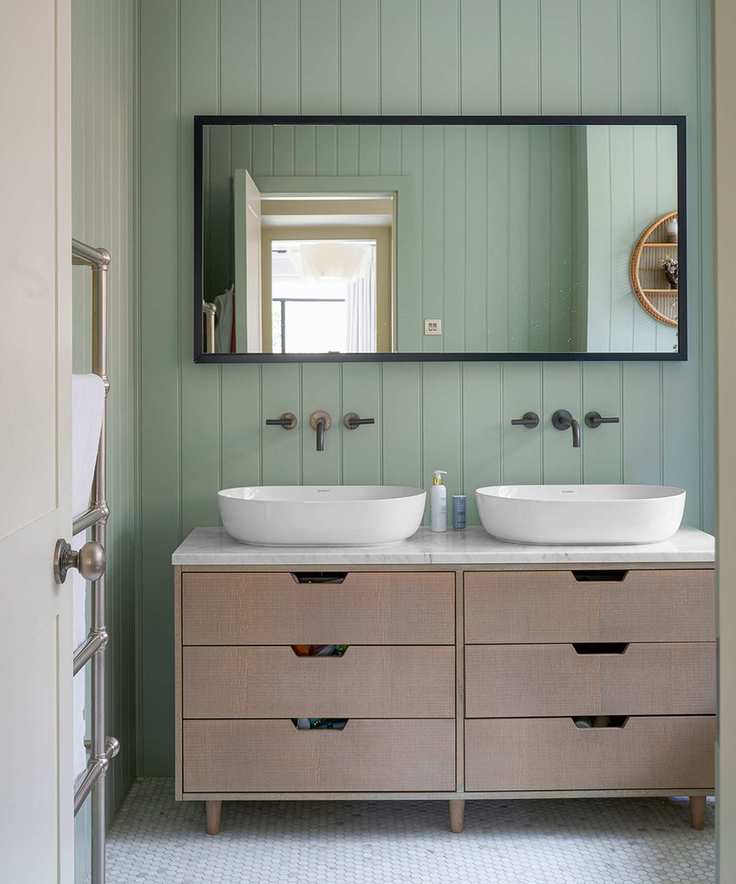 bathroom with double vanity, mirror and drawers