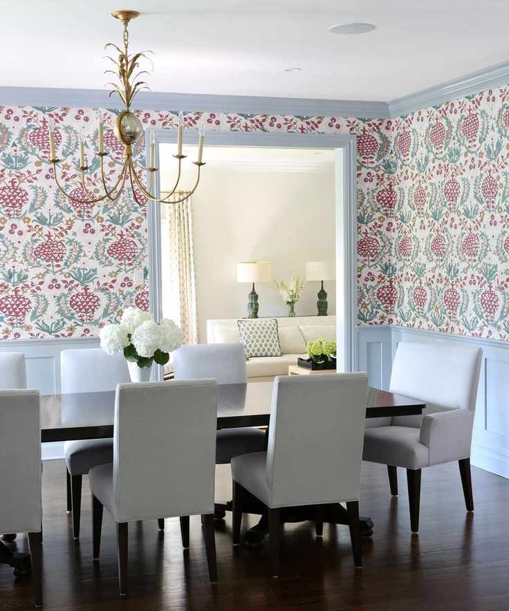 Dining room with floral wallpaper and contrasting trim