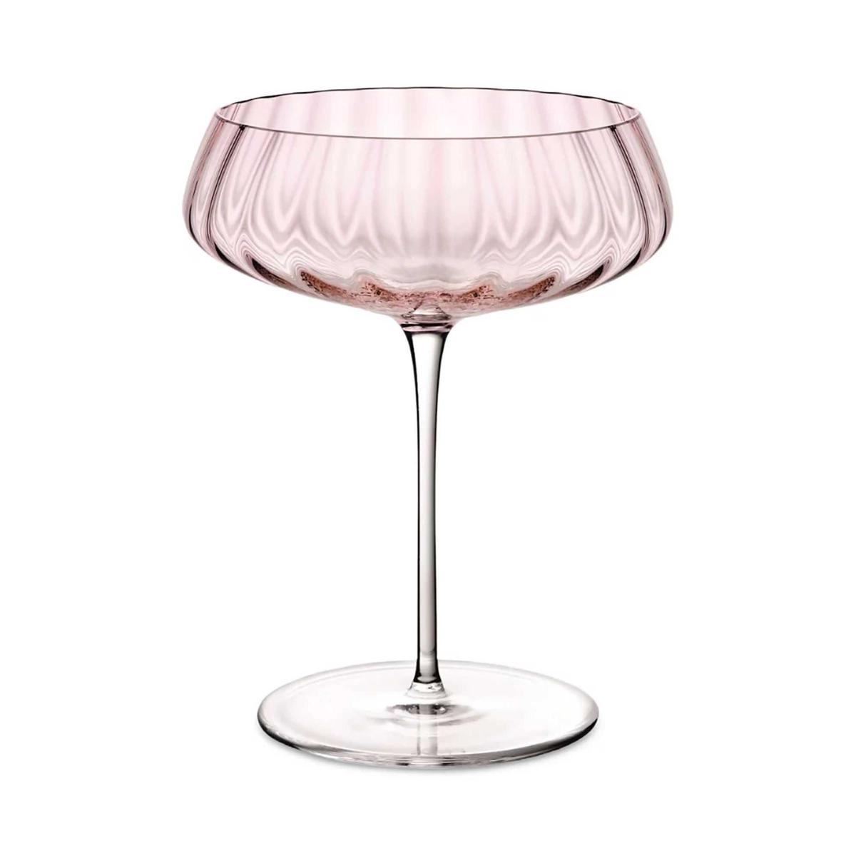 Pale pink scalloped coupe glass with a clear glass stem