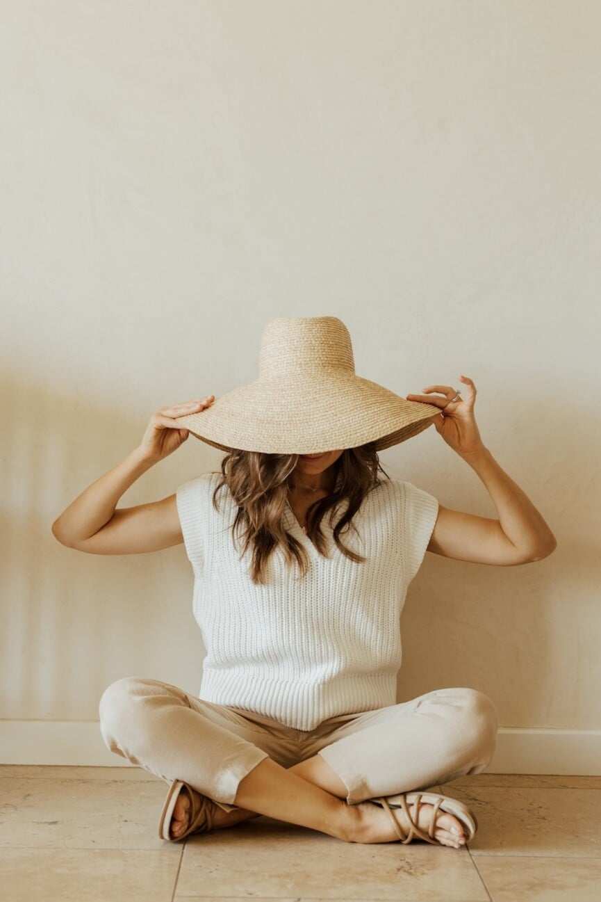 Woman wearing a sun hat.