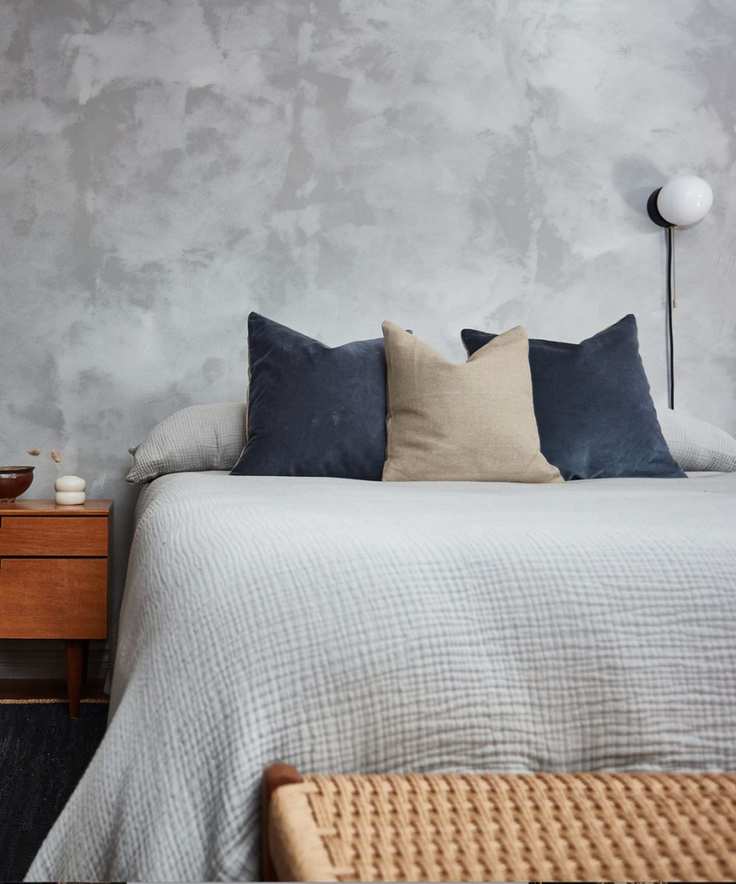 gray bedroom with plaster polished wall texture
