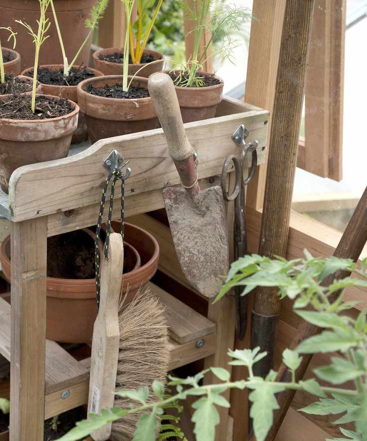 Garden trowel hanging up in a greenhouse