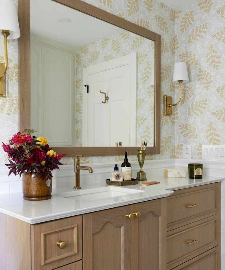 A guest bathroom with grey and yellow wallpaper