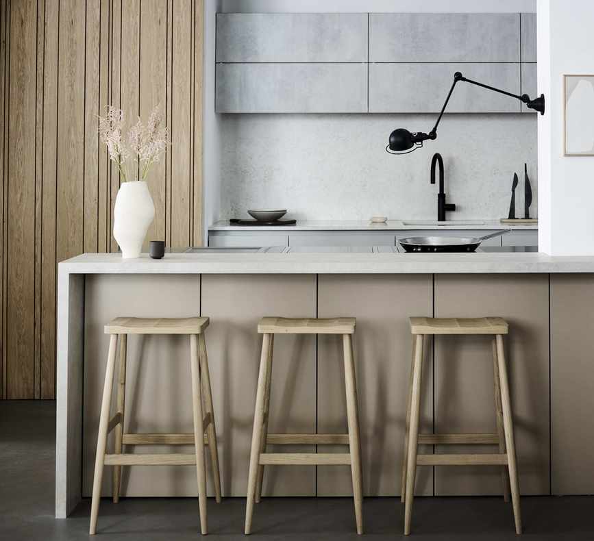 Roundhouse kitchen with wall light over the island