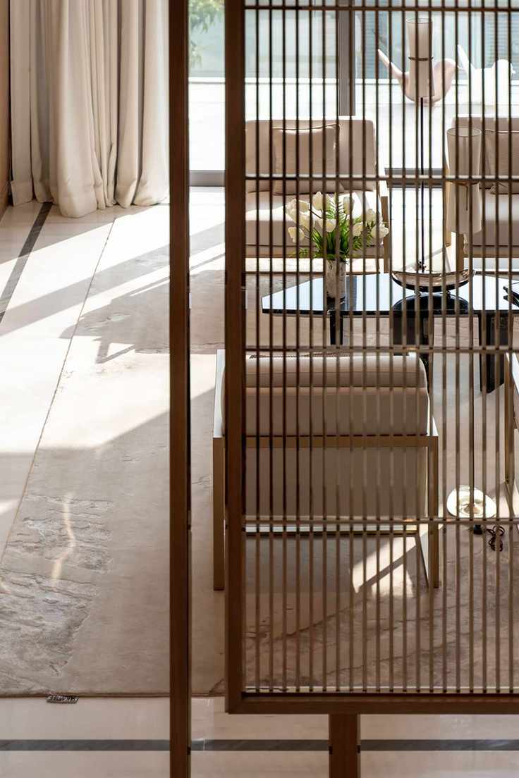 Apartment living room with slatted screen divider