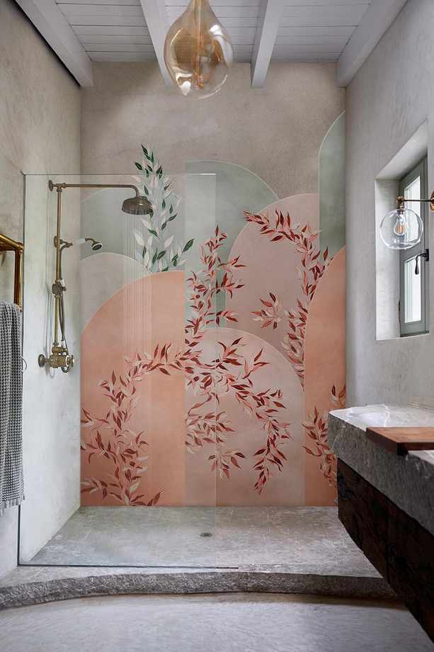 Shower design showcasing a floral wall and curved stone flooring in a compact space.
