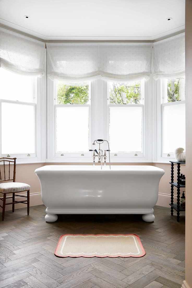 Window film and sheer blinds in a bathroom bay window