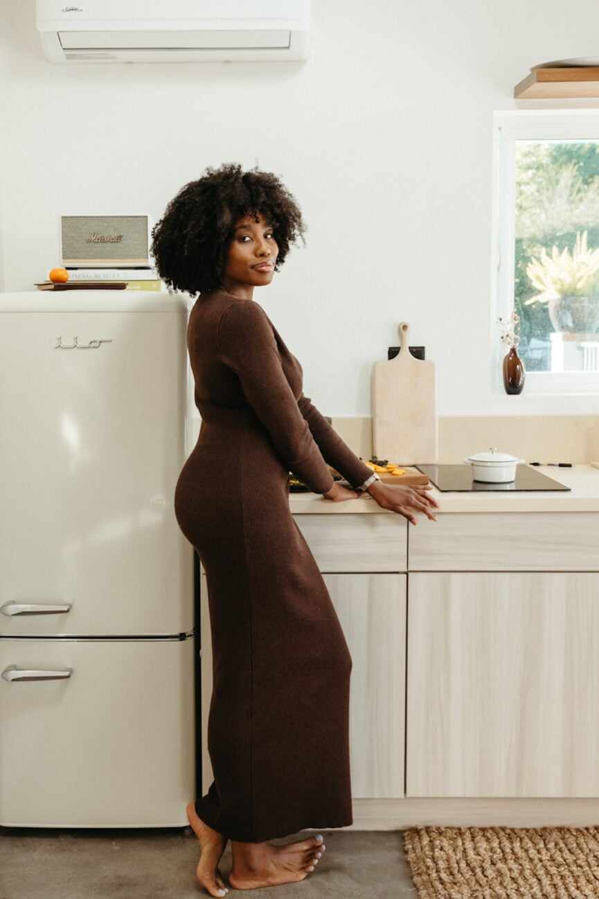 Woman in kitchen.