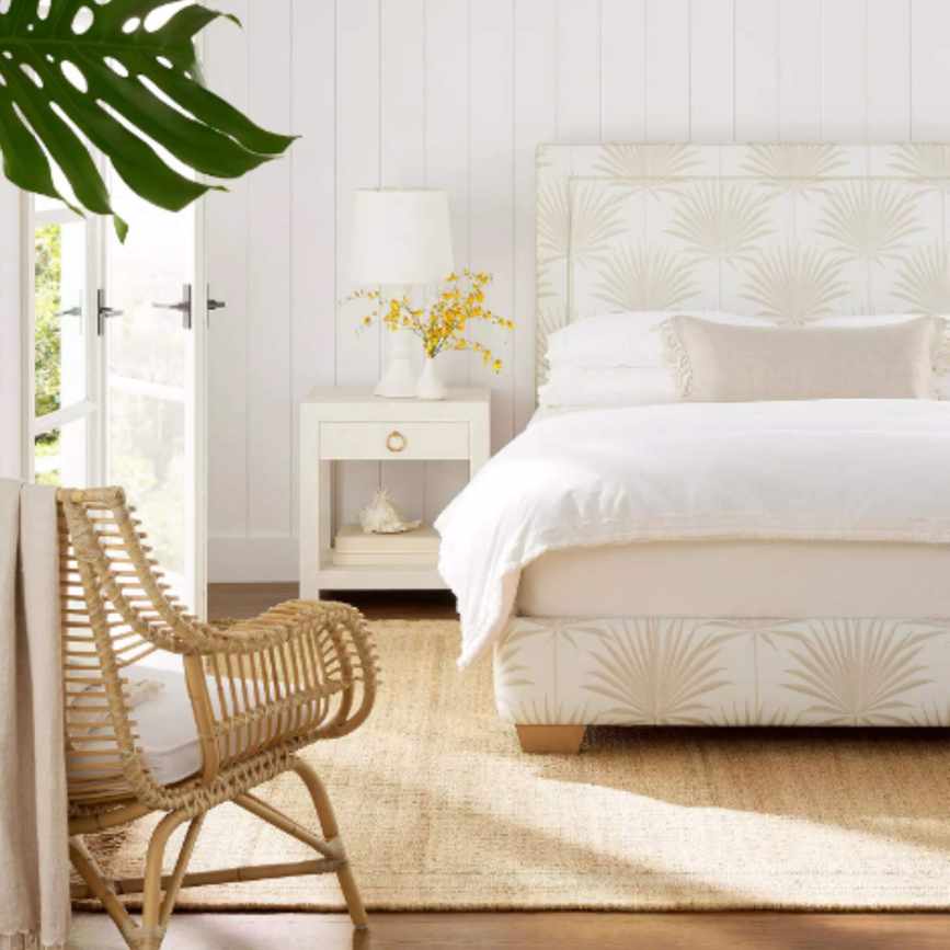 A jute rug in a neutral-toned bedroom