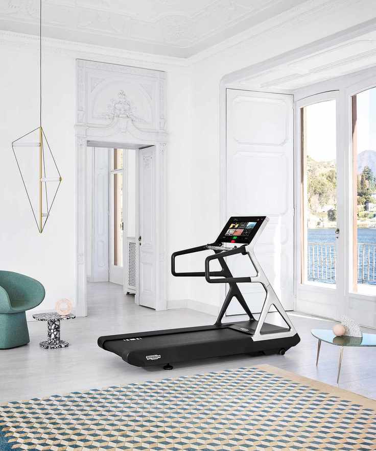 Home gym with wood floor and rug