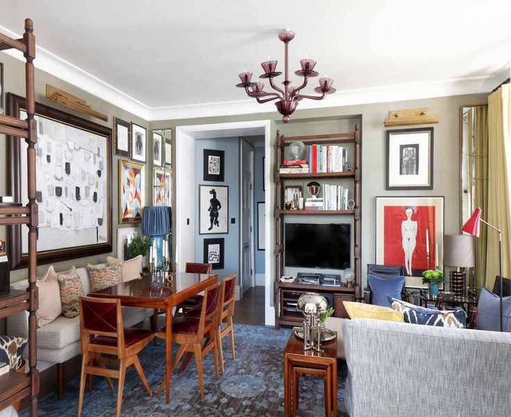 Living room with couch, dining table and chairs and banquette and neutral walls
