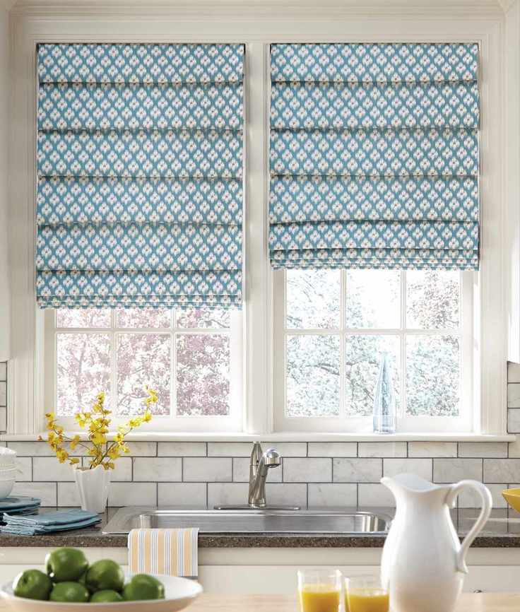 kitchen with two blue blinds above sink