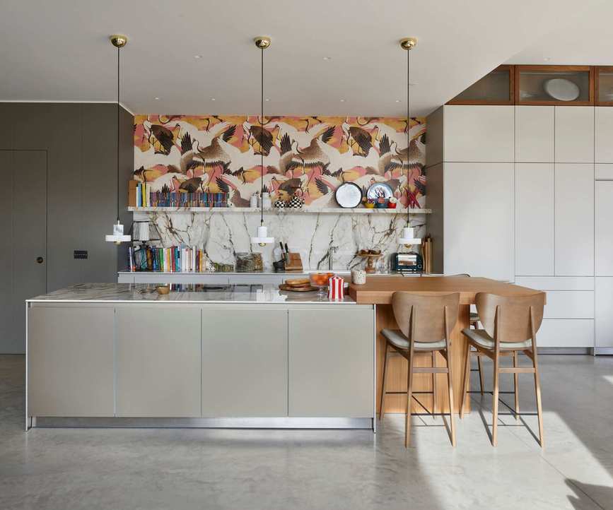 A modern kitchen adorned with striking botanical wallpaper