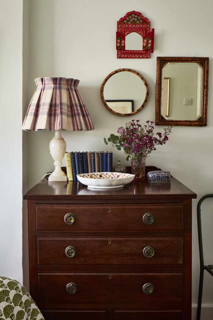 Bedside table with gallery wall of mirrors