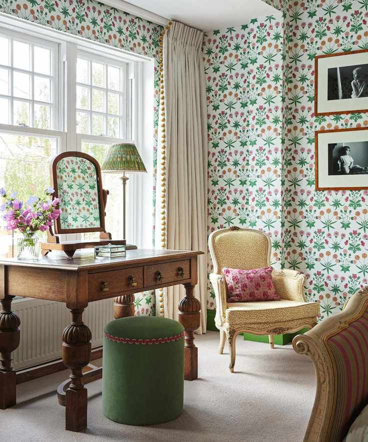 Dressing space in bedroom with green and white floral wallpaper