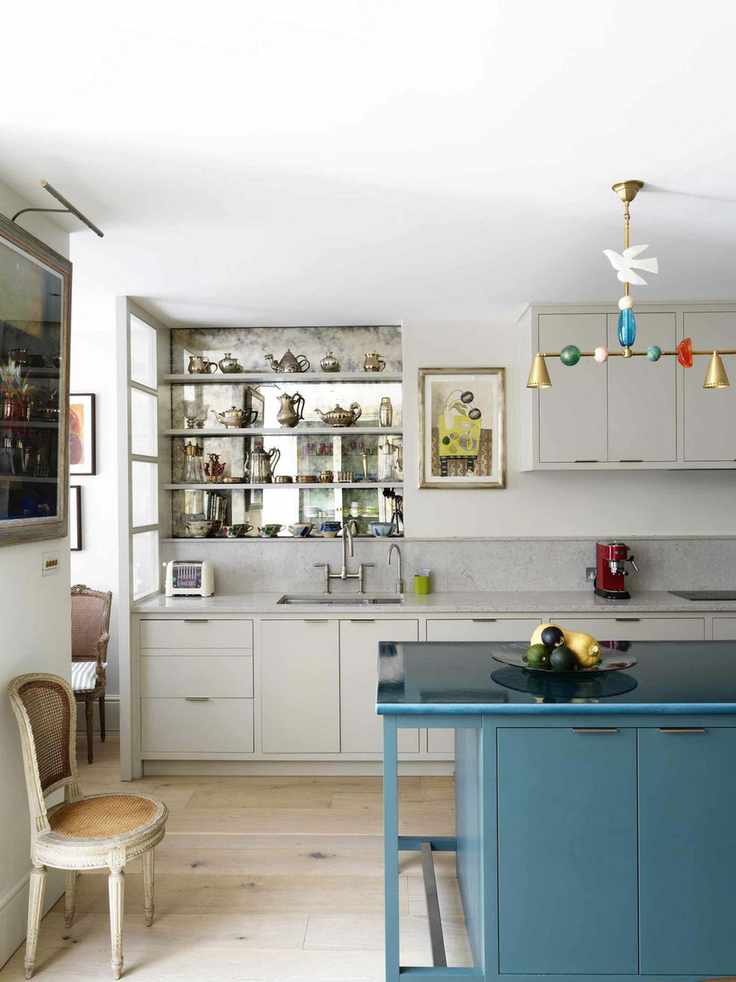 Kitchen with neutral cabinets and blue island