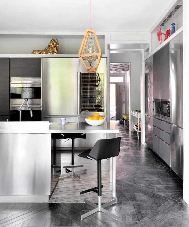 Modern kitchen with stainless steel island and matching cabinet doors