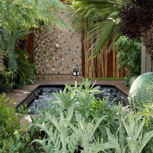 Tropical-style backyard with outdoor pool, decking and outdoor shower