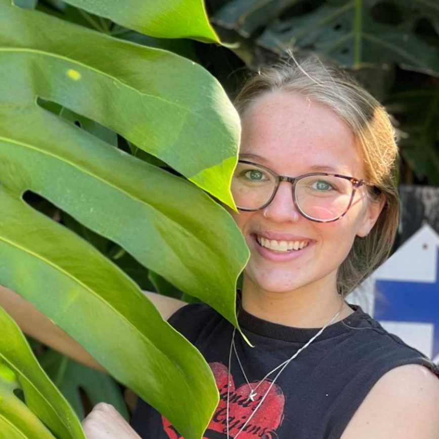 smiling headshot of Kiersten Rankel with a leaf