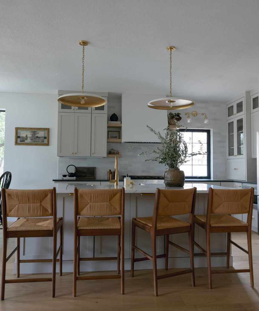 A kitchen with cabinets painted in Revere Pewter.