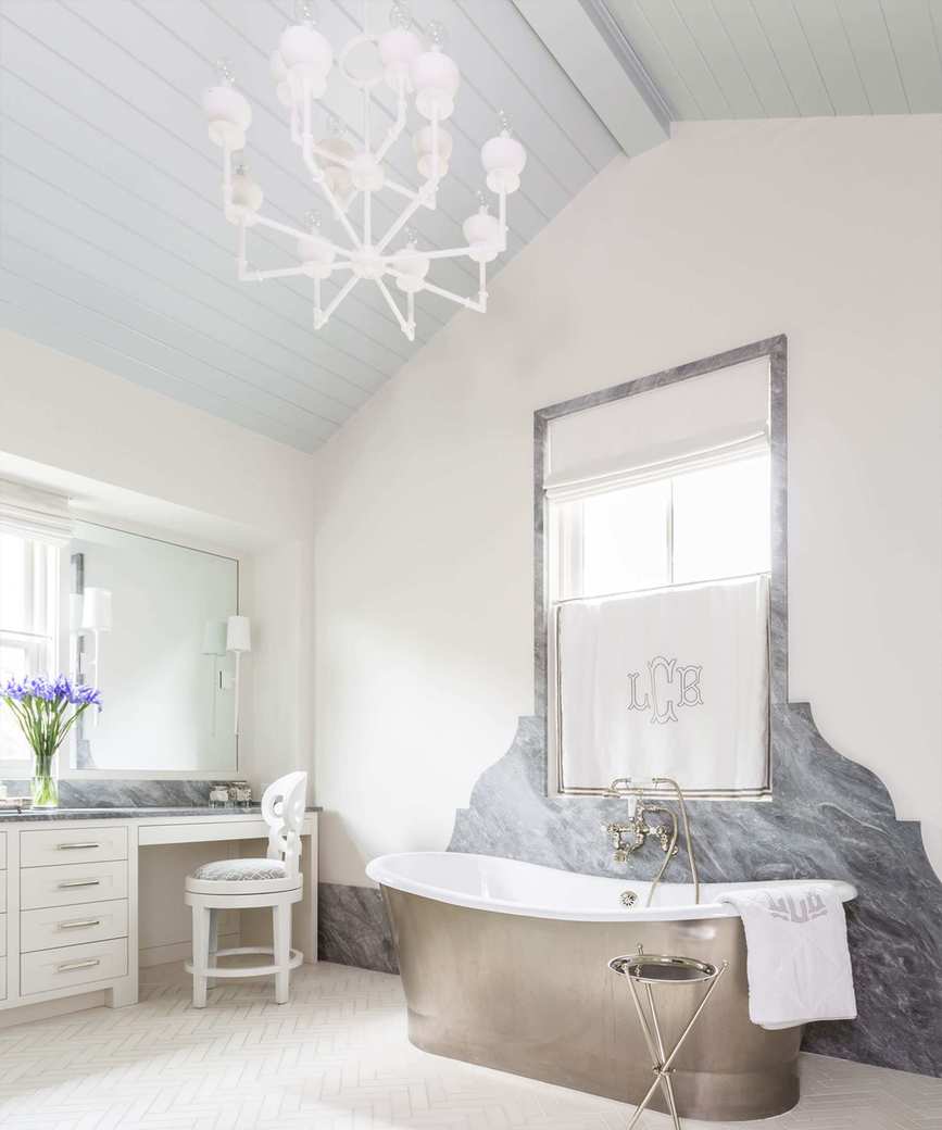Bright bathroom with a pale blue wooden ceiling