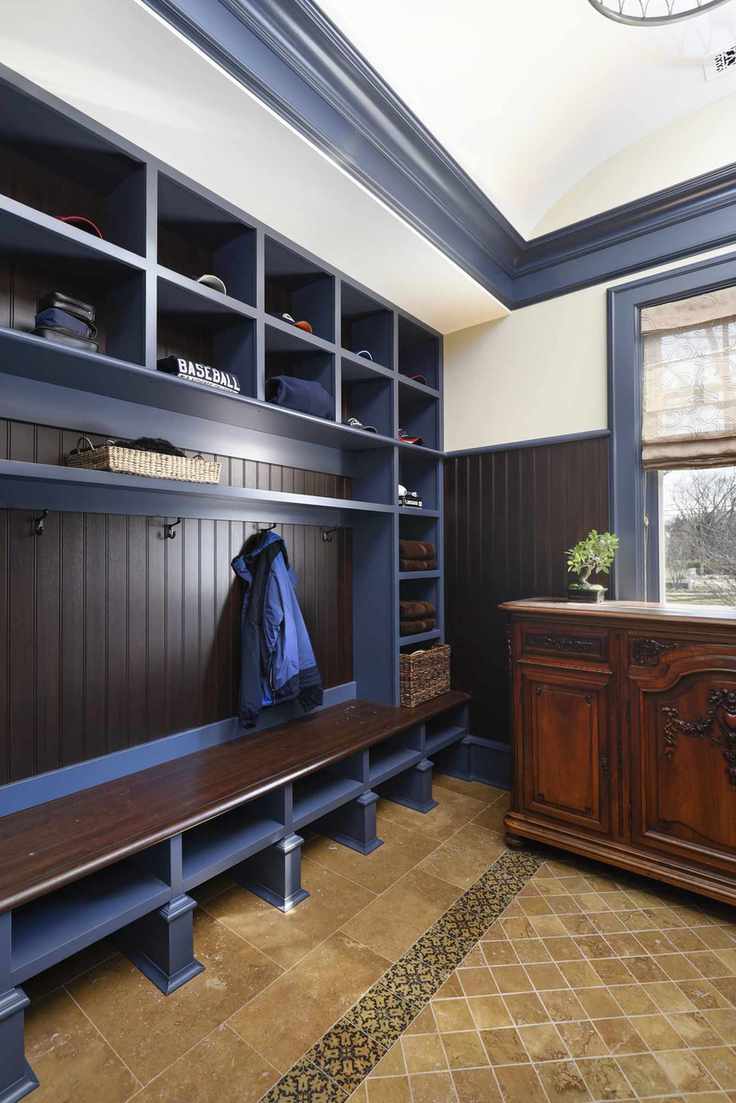 clubroom style mudroom with lockers and antique chest of drawers
