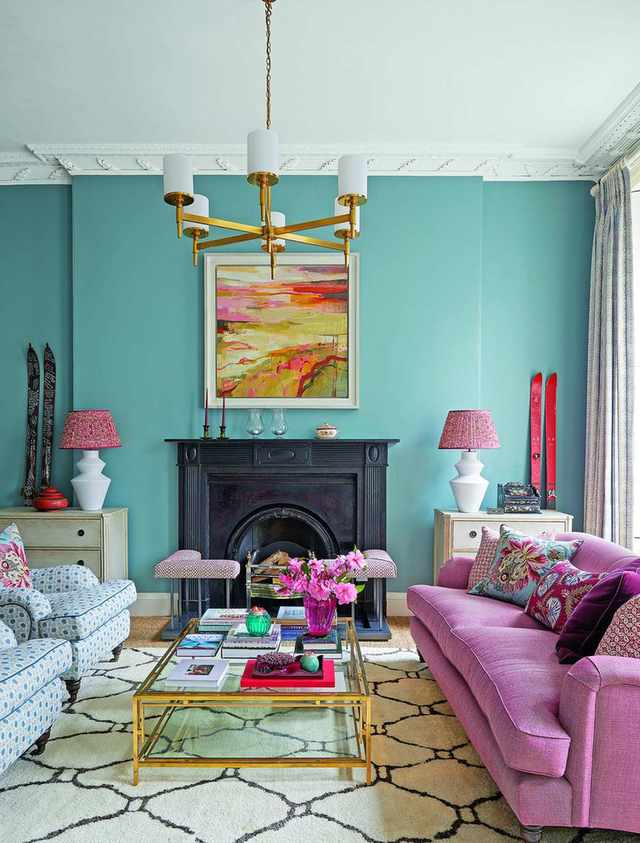 blue living room with pink sofa