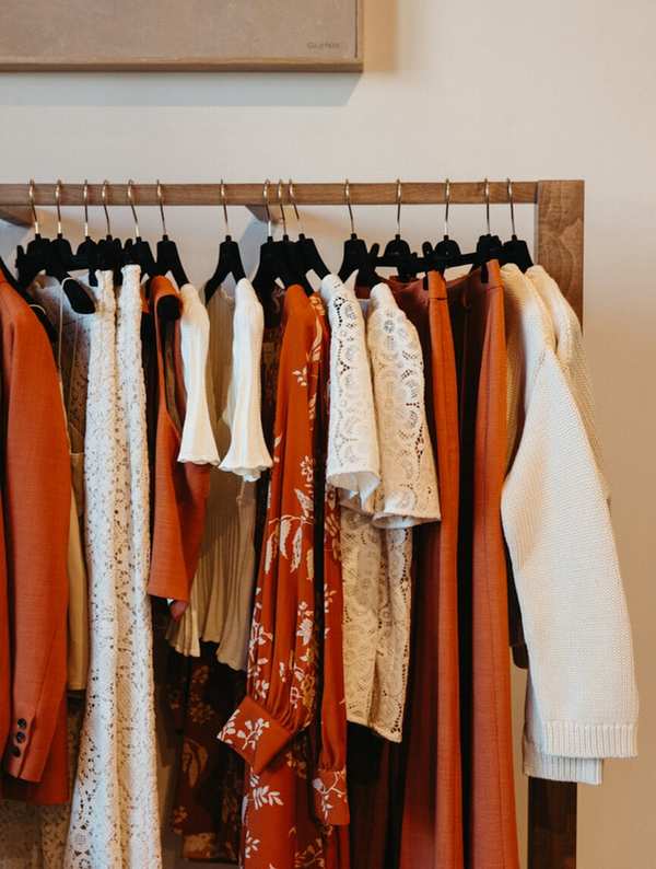 Clothes hanging on clothing rack