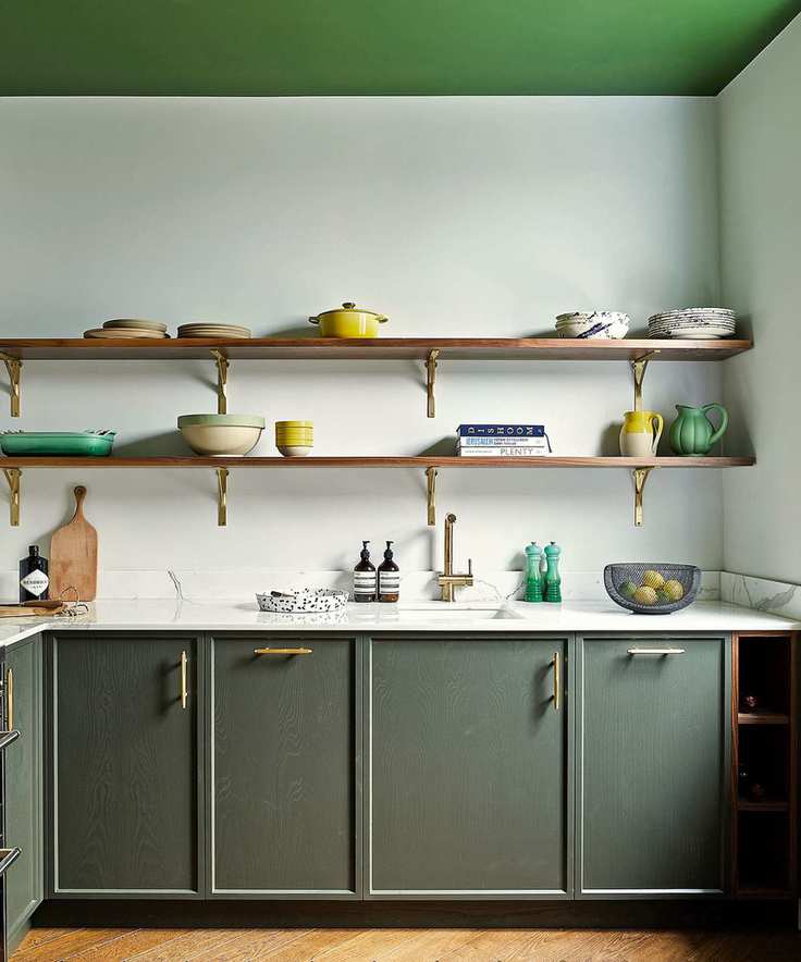 Colorful kitchen with green ceiling and cabinet