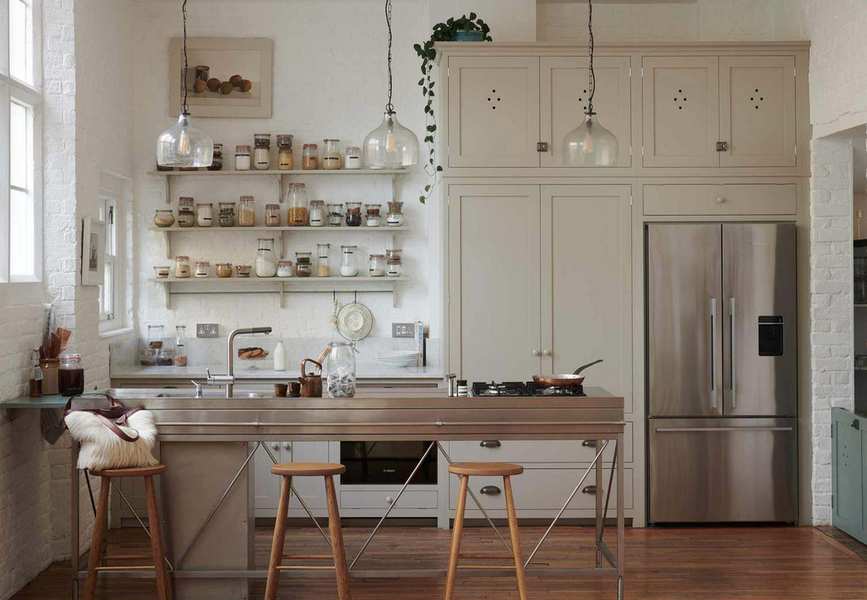 Kitchen with neutral cabinets and metal island