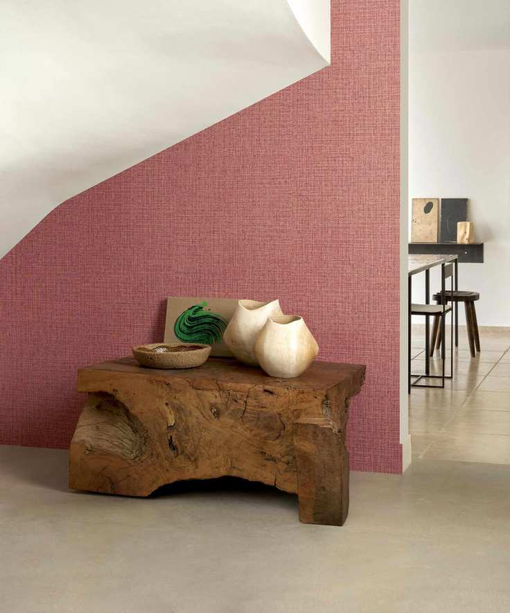 Hallway with red patterned wallpaper and neutral accents