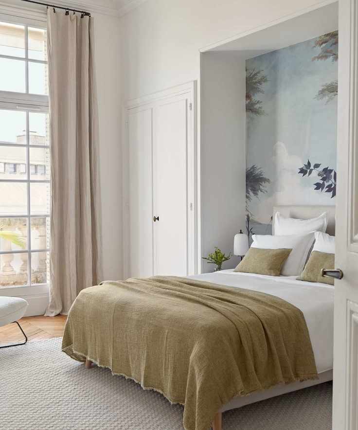 Bedroom with mural and alcove