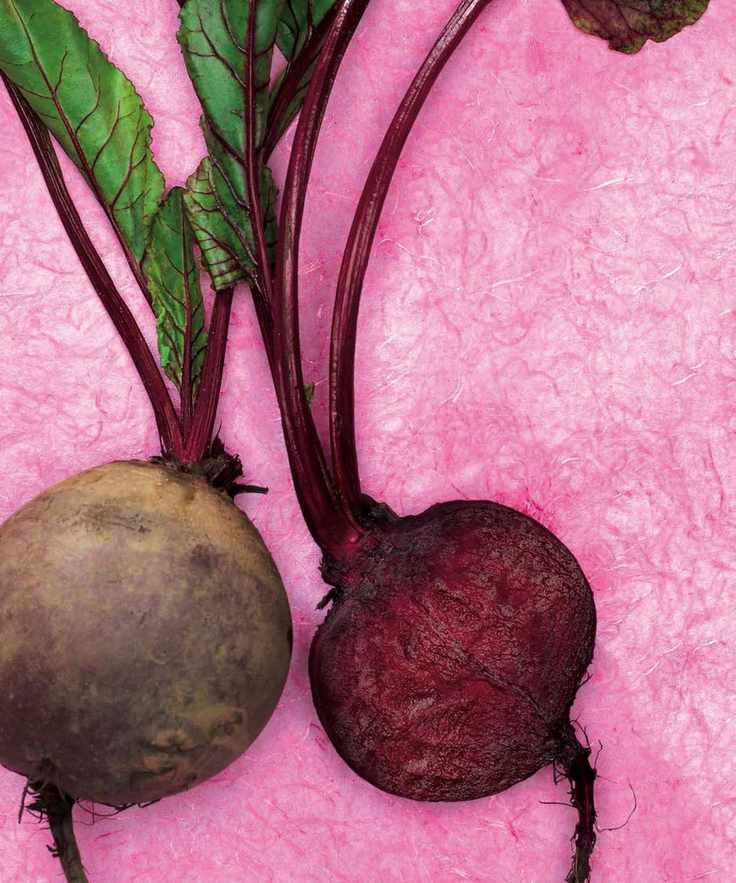 A chopped beet on a pink background