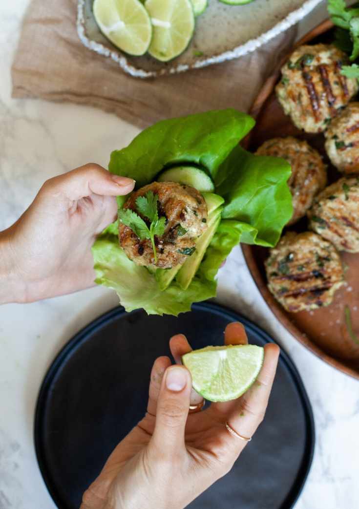 assembling chicken burger lettuce wraps
