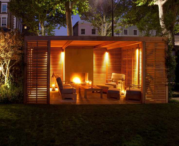 contemporary town garden with lit pergola