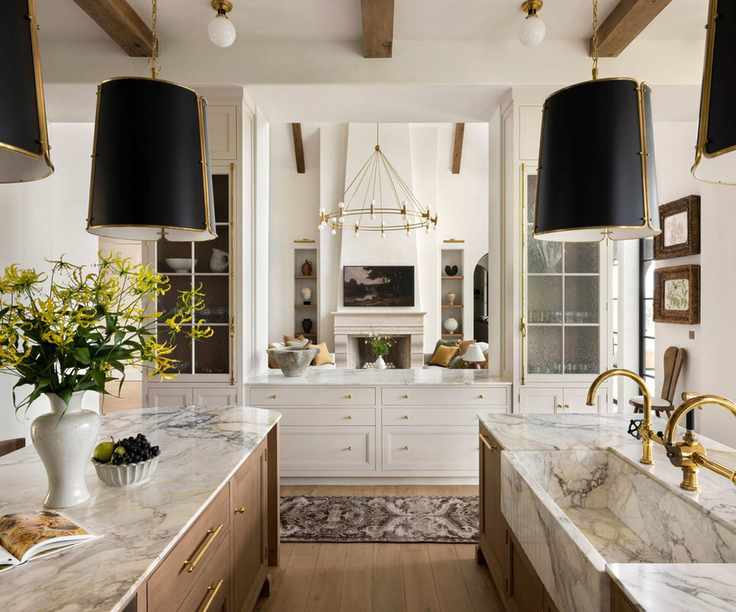 A double island kitchen with a hatch into the living space