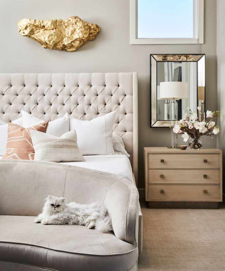 Cream bedroom with wood side table