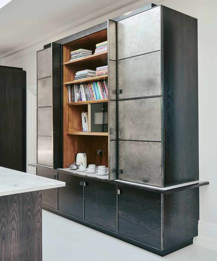Dark kitchen cabinetry with metallic elements