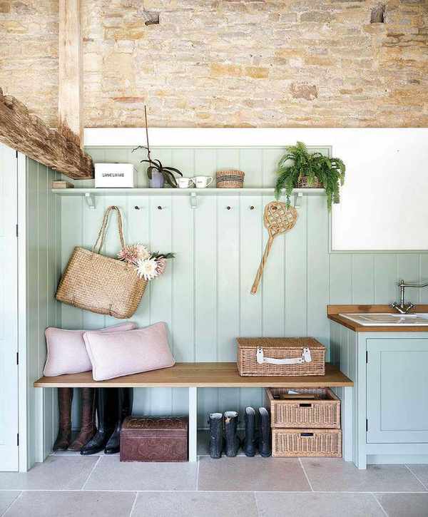 Country bootroom with panelling and fitted seat