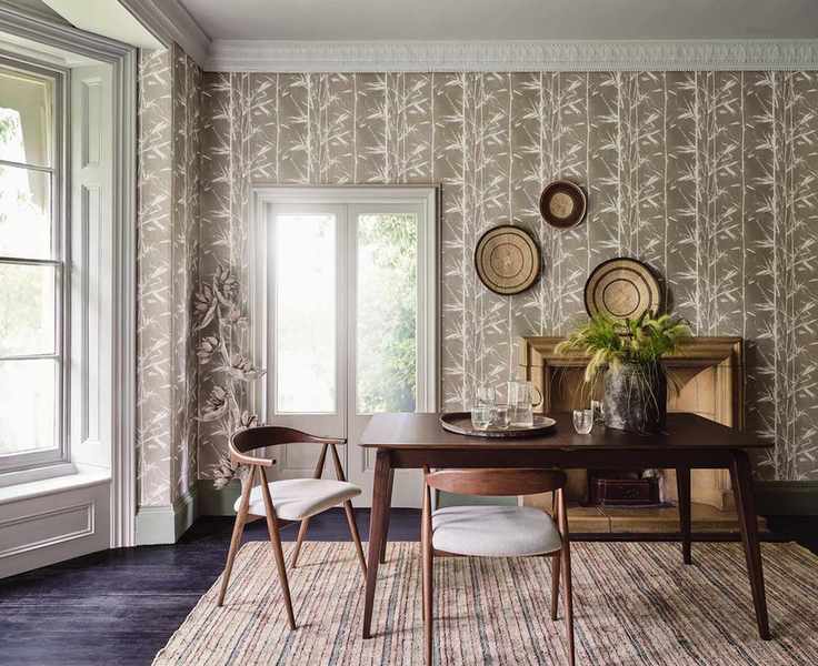 Dining room with nature-inspired wallpaper
