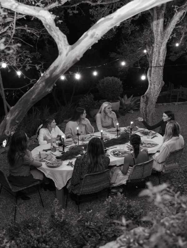 Friends at holiday backyard dinner party