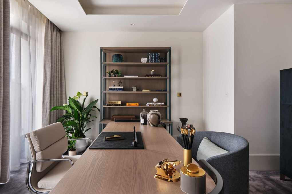 Wooden desk with brass accessories and shelving